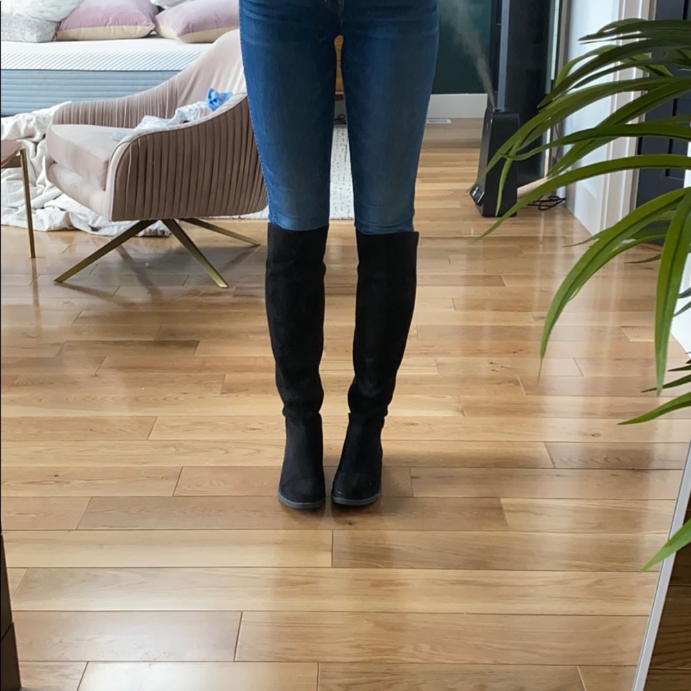 Black high riding style boots